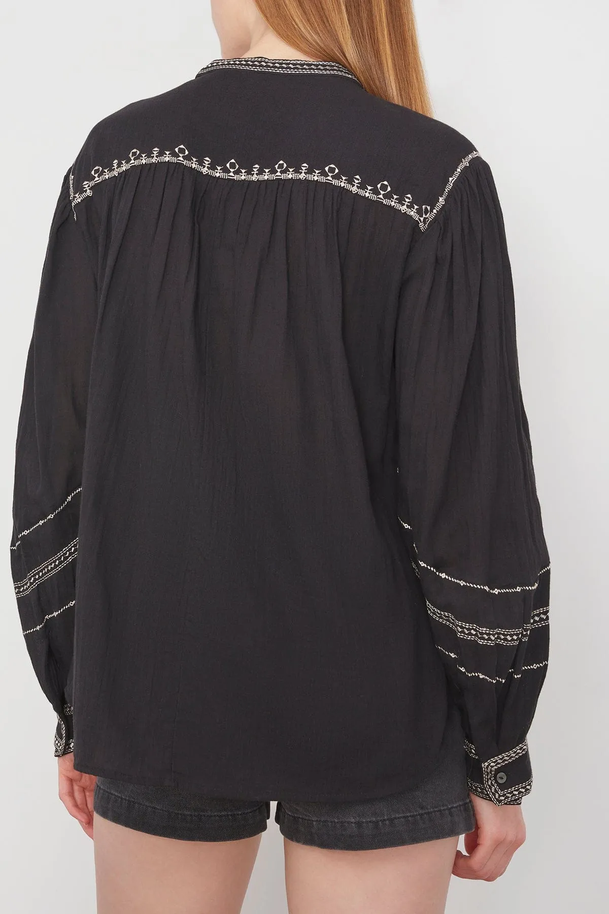 Sure! Heres an optimized title with modifiers: 

Chic Black Pelson Top - Sleek, Comfortable, and Versatile Womens Blouse